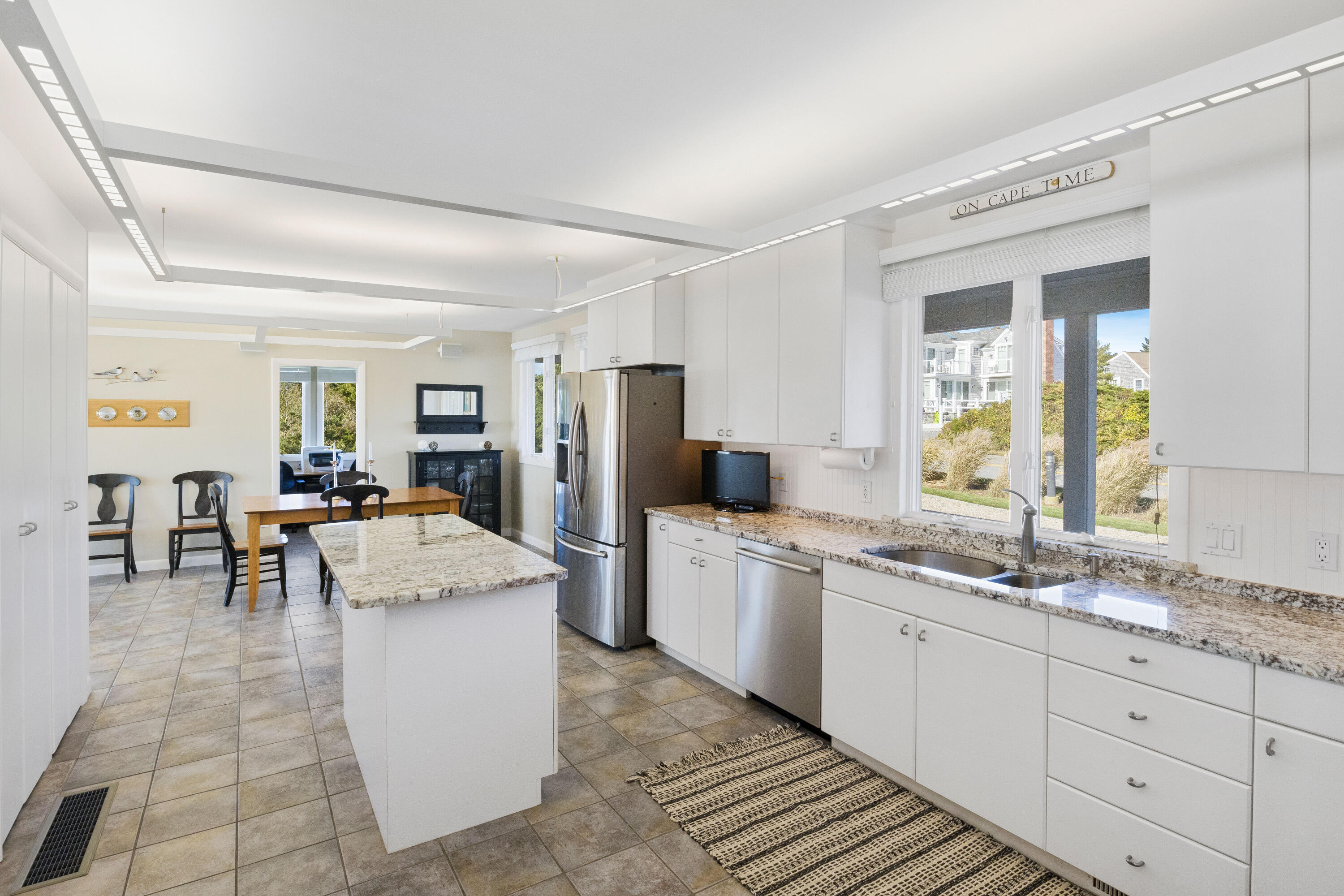 43 Shore Road West Harwich, MA 02671 - Photo 19 of 40 a large white kitchen with a stove a sink dishwasher and a refrigerator