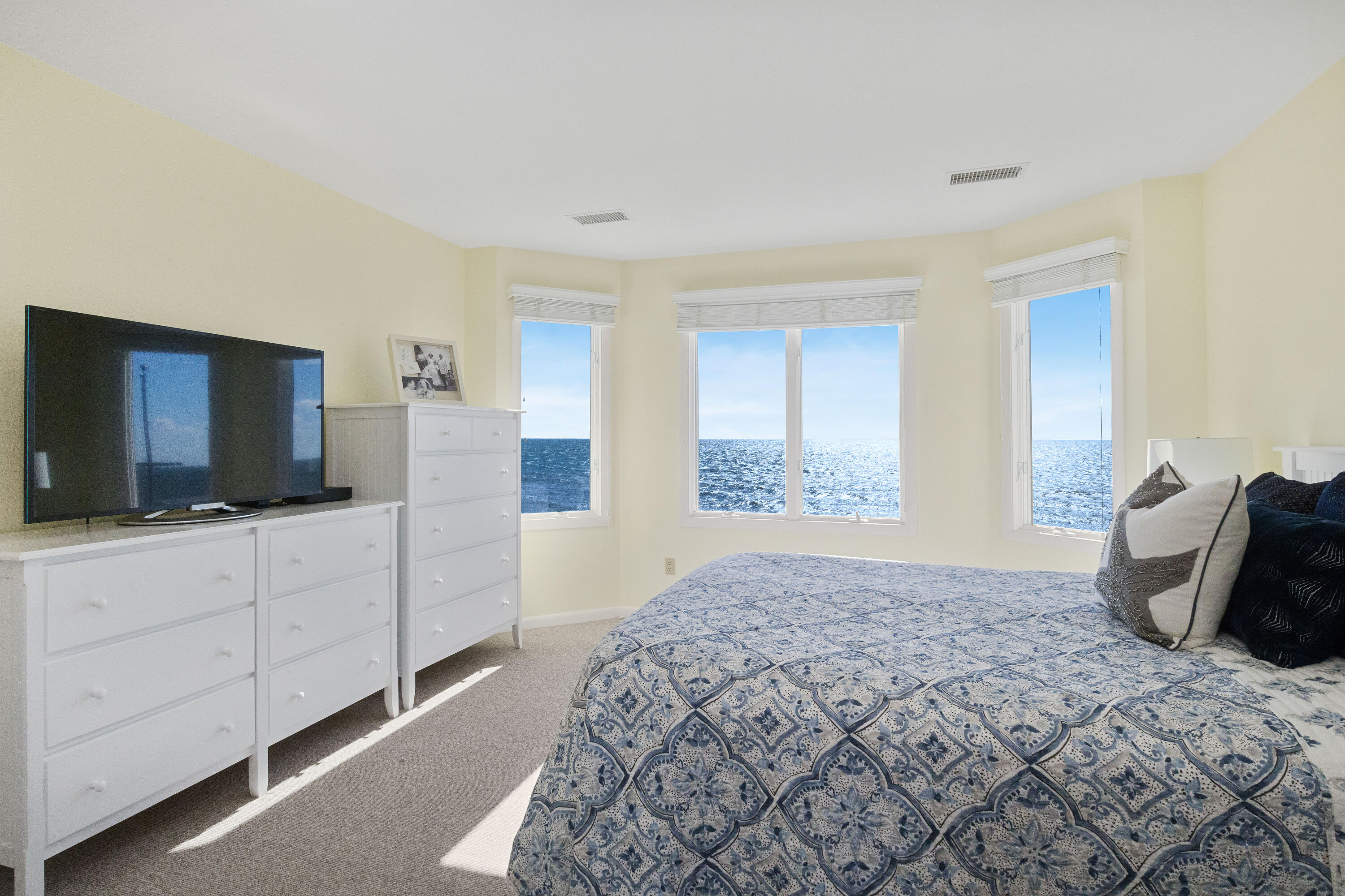 43 Shore Road West Harwich, MA 02671 - Photo 23 of 40 a bedroom with a bed and a flat screen tv