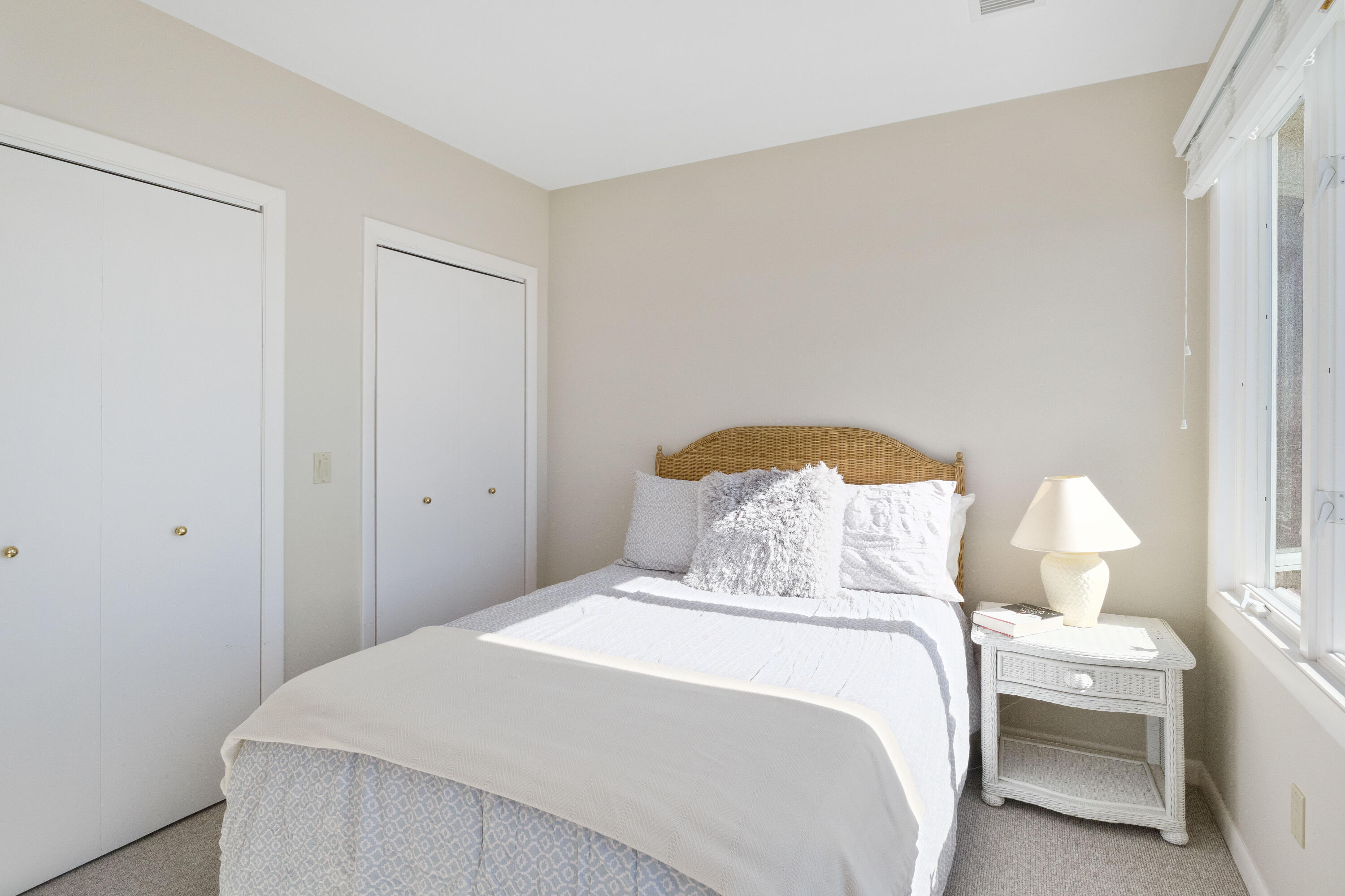 43 Shore Road West Harwich, MA 02671 - Photo 29 of 40 a bedroom with a bed and a lamp
