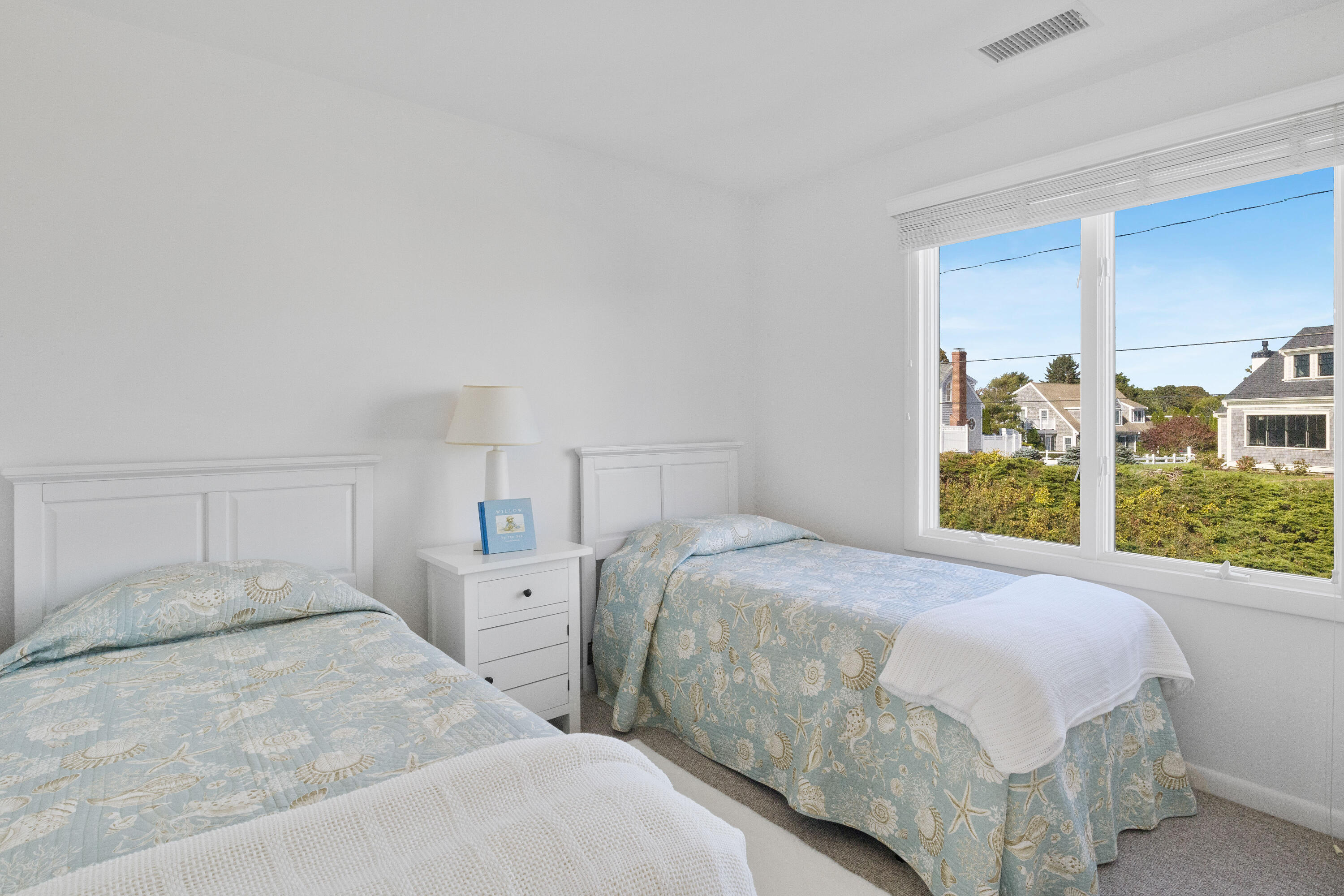 43 Shore Road West Harwich, MA 02671 - Photo 30 of 40 a bedroom with a large bed and a large window