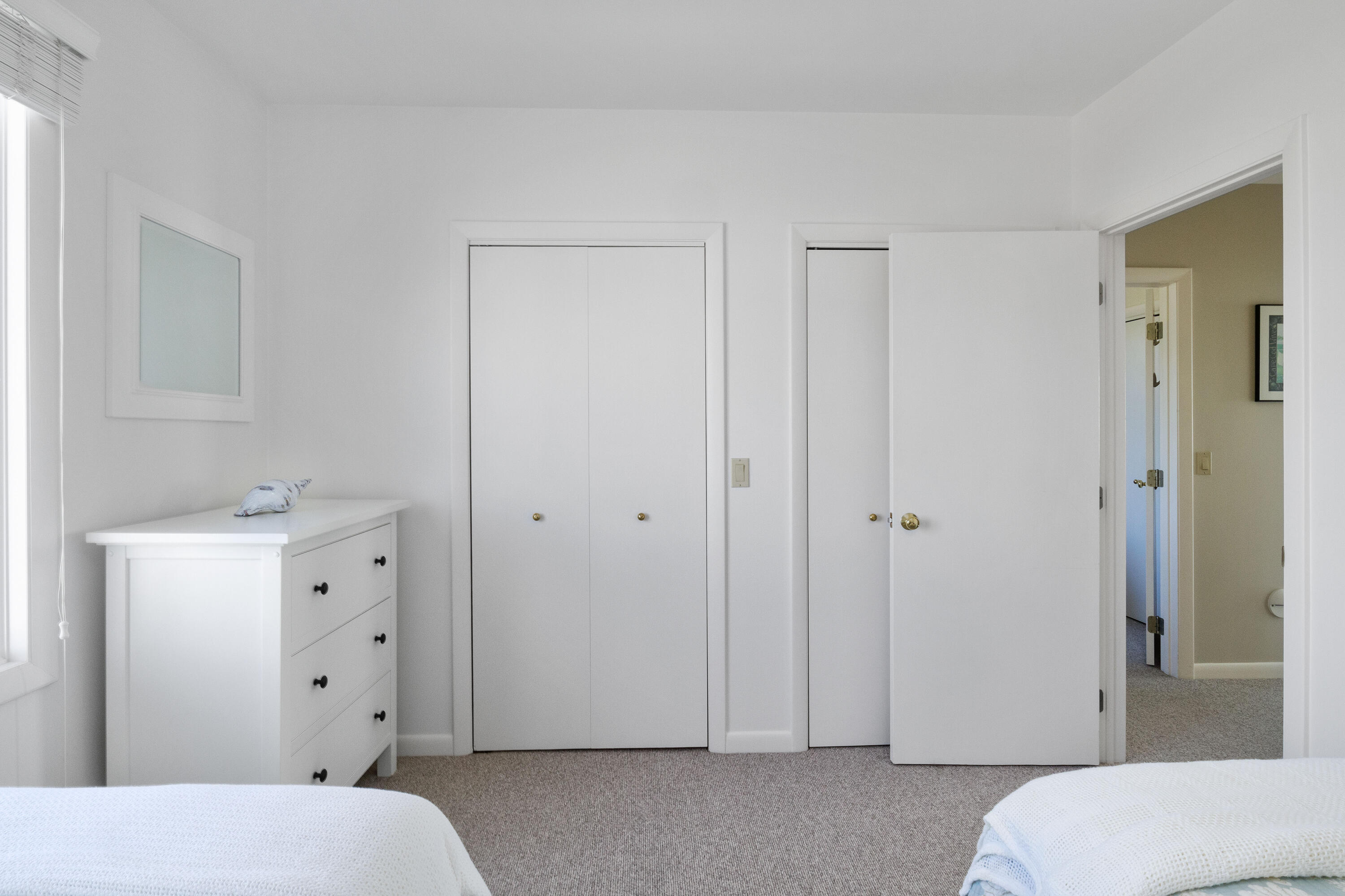 43 Shore Road West Harwich, MA 02671 - Photo 31 of 40 a room with a white bed and closet