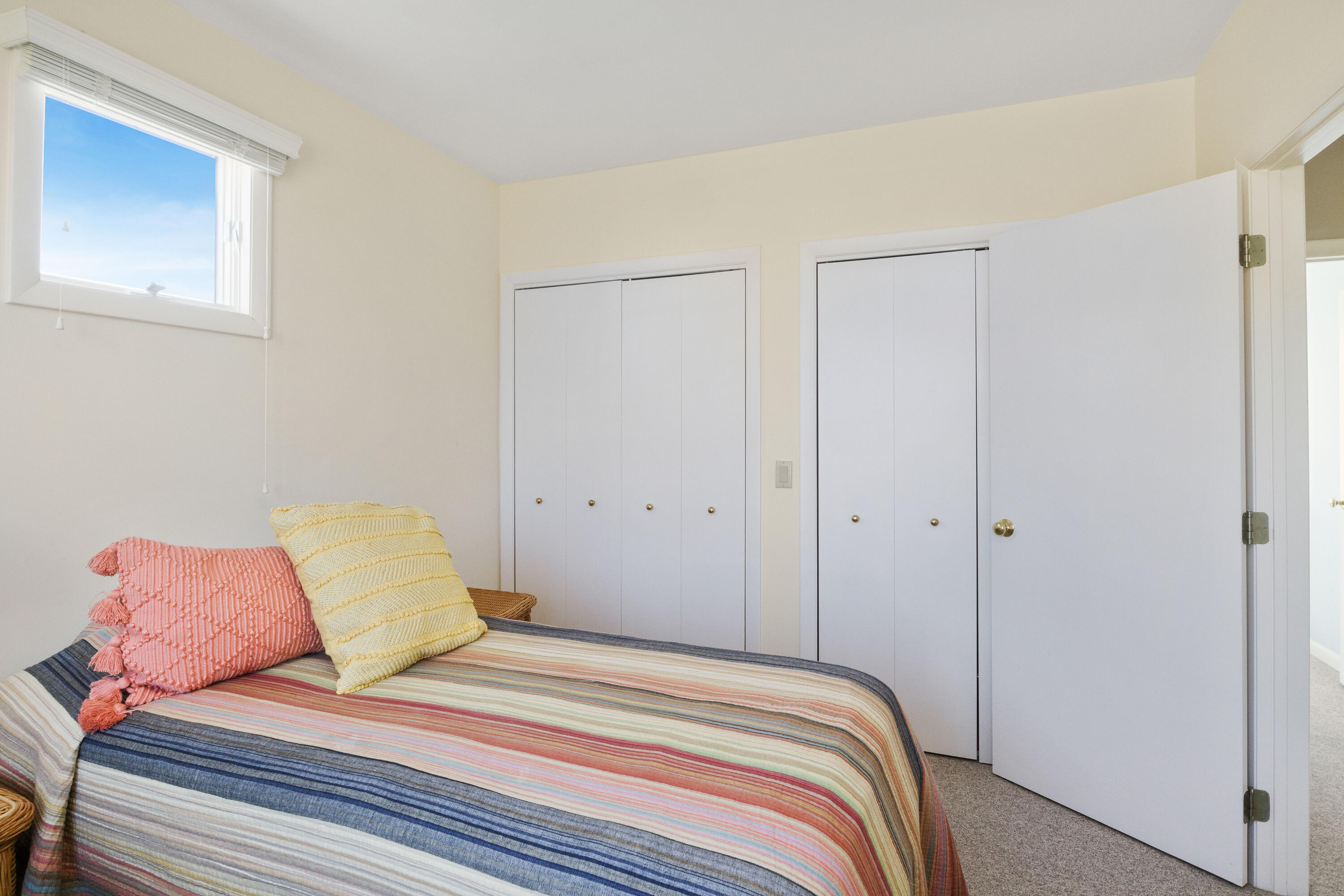 43 Shore Road West Harwich, MA 02671 - Photo 33 of 40 a bedroom with a bed and a painting on the wall