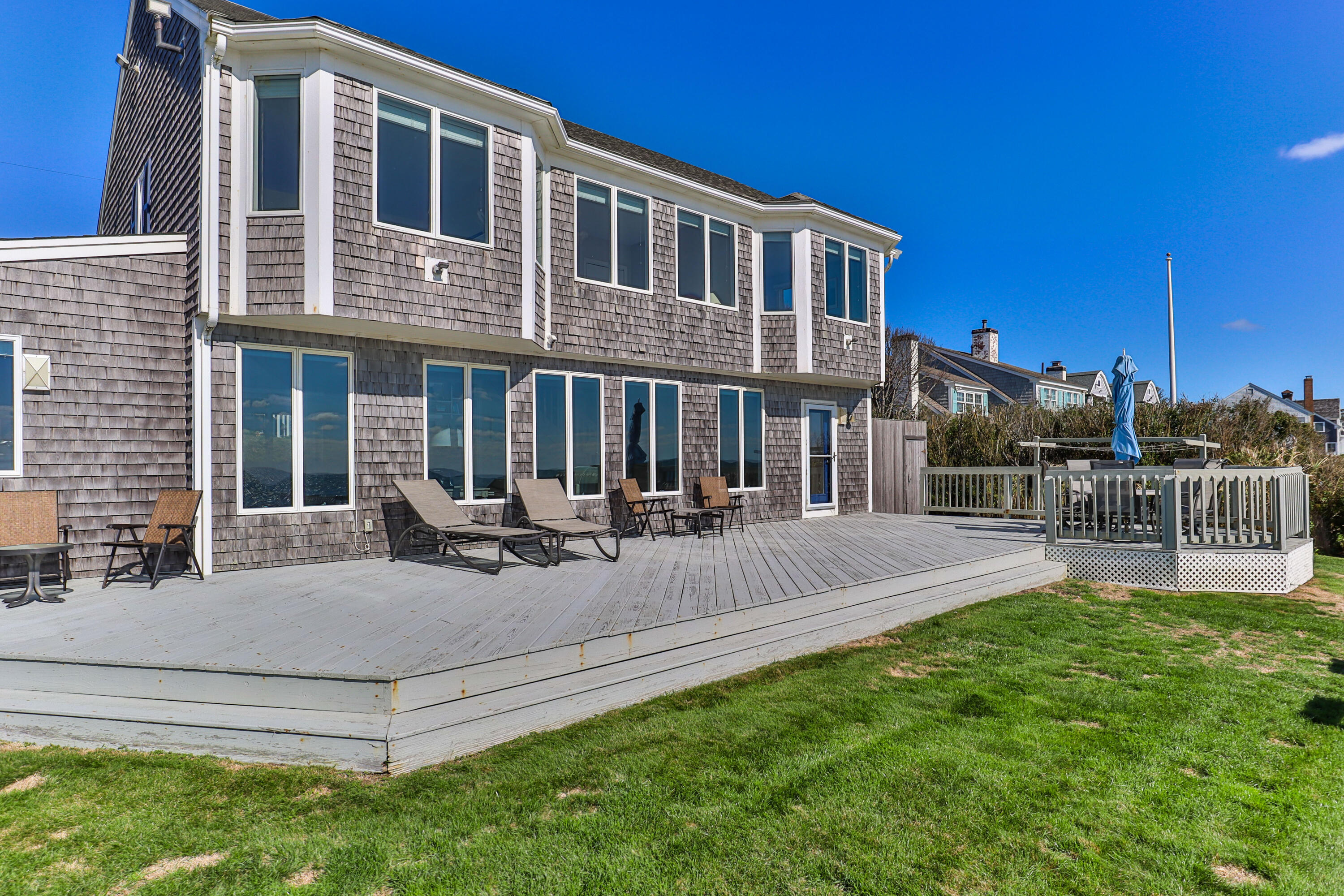 43 Shore Road West Harwich, MA 02671 - Photo 35 of 40 a view of a house with backyard and sitting area