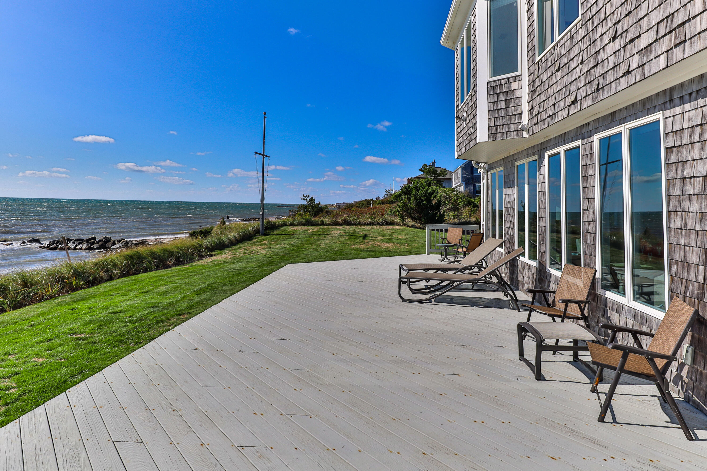 43 Shore Road West Harwich, MA 02671 - Photo 7 of 40 a view of a patio with table and chairs and garden