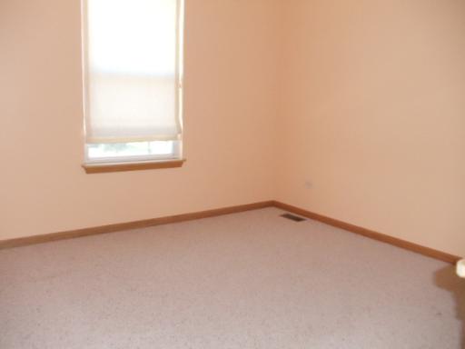 1607 Rose Court Romeoville, IL 60446 - Photo 14 of 15 a view of a small space with wooden floor and a window