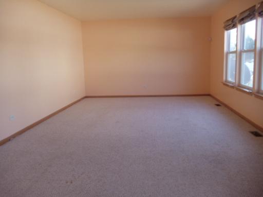 1607 Rose Court Romeoville, IL 60446 - Photo 6 of 15 a view of a room that has a window in it