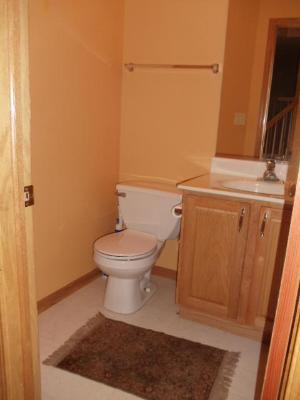 1607 Rose Court Romeoville, IL 60446 - Photo 7 of 15 a white toilet sitting next to a sink