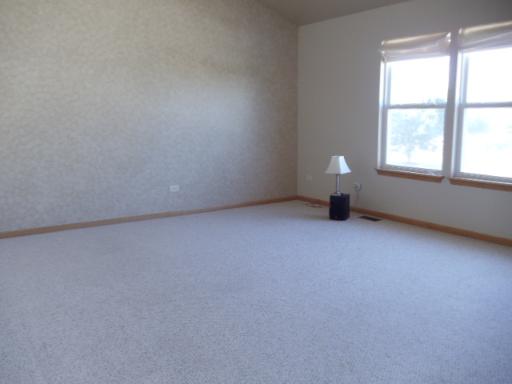 1607 Rose Court Romeoville, IL 60446 - Photo 8 of 15 an empty room with a window