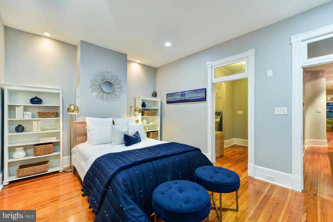 1319 T Street Northwest Washington, DC 20009 - Photo 11 of 25 a bedroom with a bed and a view of kitchen