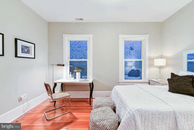 1319 T Street Northwest Washington, DC 20009 - Photo 15 of 25 a bedroom with a bed and a table with chair