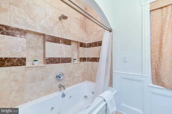 1319 T Street Northwest Washington, DC 20009 - Photo 17 of 25 a bathroom with a bathtub and a shower