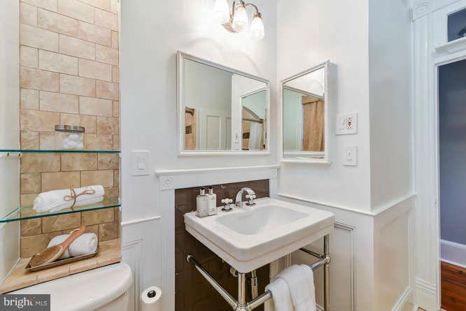 1319 T Street Northwest Washington, DC 20009 - Photo 18 of 25 a bathroom with a sink and a mirror