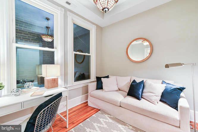 1319 T Street Northwest Washington, DC 20009 - Photo 5 of 25 a living room with furniture and a window
