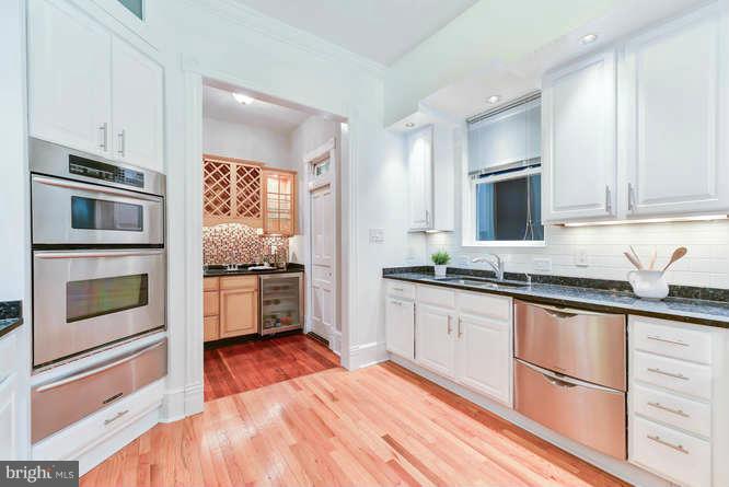 1319 T Street Northwest Washington, DC 20009 - Photo 7 of 25 a kitchen with granite countertop stainless steel appliances and cabinets
