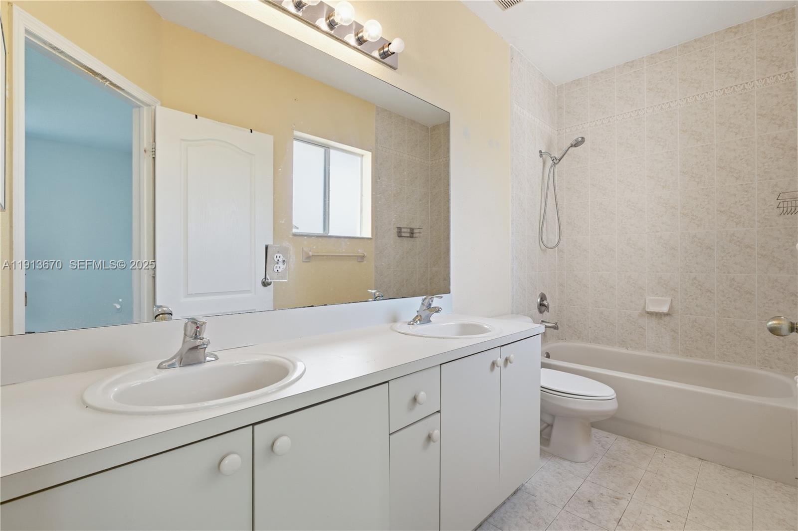 21460 Southwest 85th Passage Cutler Bay, FL 33189 - Photo 16 of 20 a bathroom with a sink a toilet and shower
