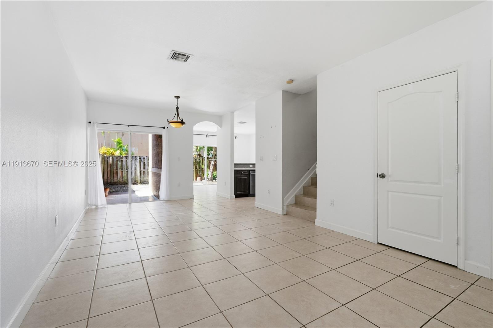 21460 Southwest 85th Passage Cutler Bay, FL 33189 - Photo 4 of 20 a view of a entryway with kitchen and livingroom view