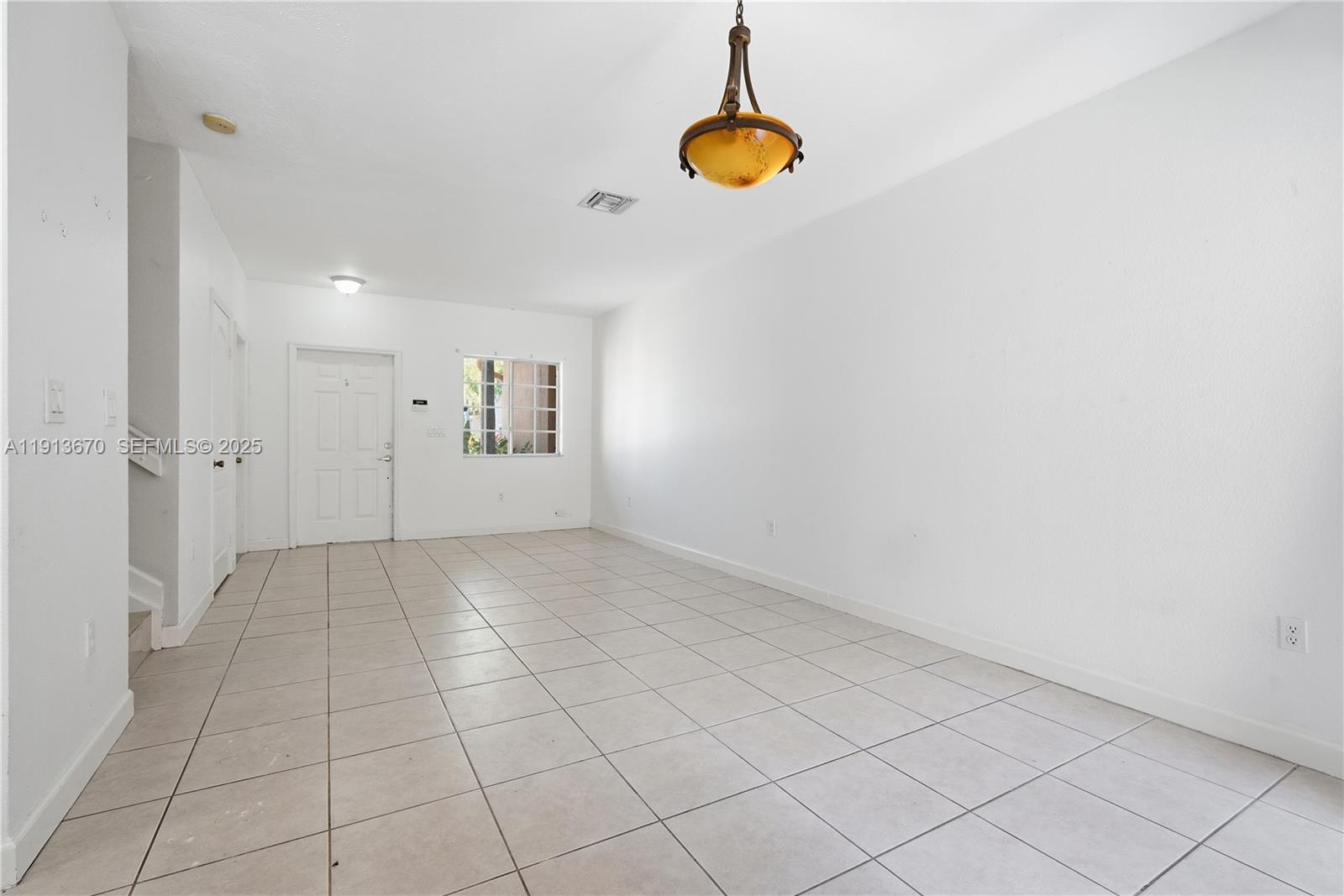 21460 Southwest 85th Passage Cutler Bay, FL 33189 - Photo 5 of 20 an empty room with windows