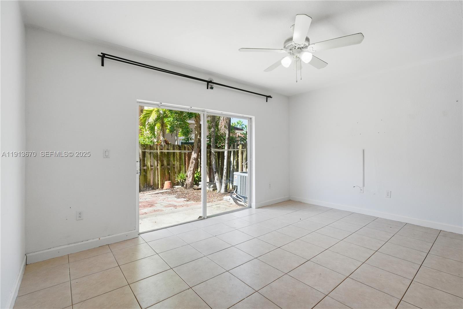 21460 Southwest 85th Passage Cutler Bay, FL 33189 - Photo 7 of 20 a view of an empty room with a window