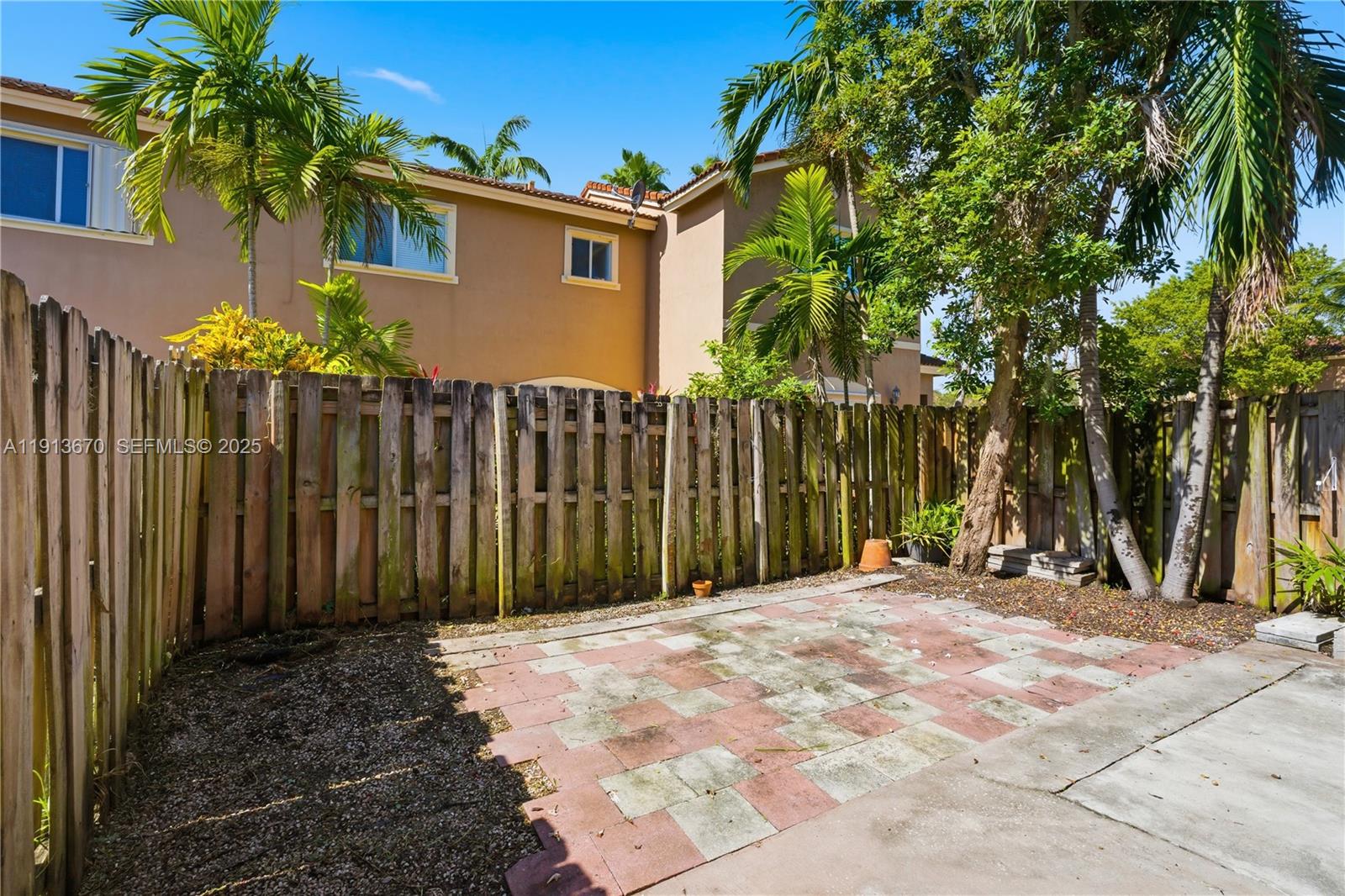 21460 Southwest 85th Passage Cutler Bay, FL 33189 - Photo 9 of 20 a view of a house with wooden fence
