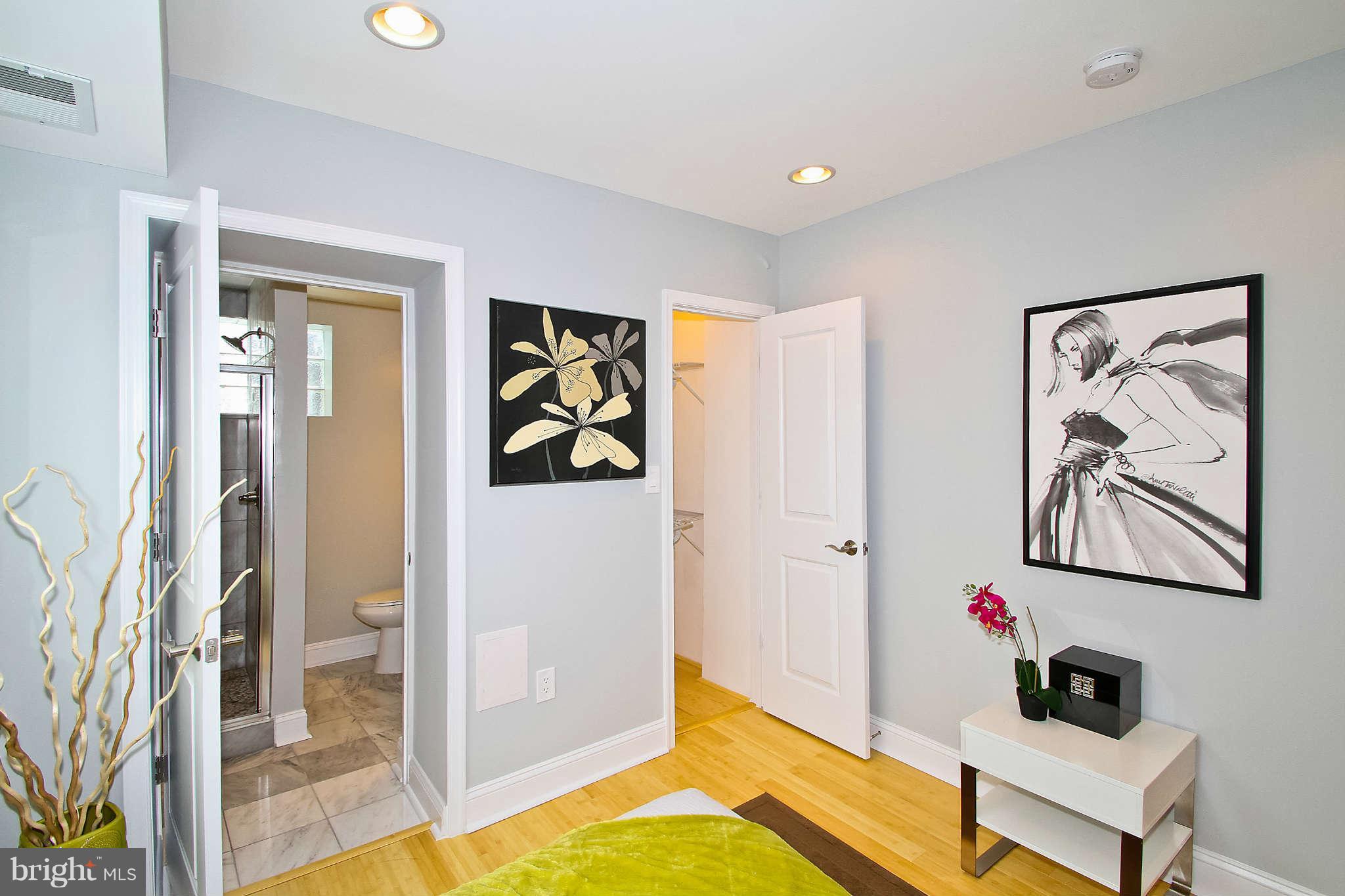 604 Columbia Road Northwest, Unit 1 Washington, DC 20001 - Photo 12 of 17 a view of a bedroom with furniture and front door