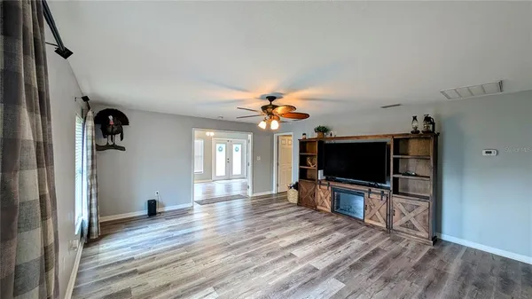 a view of living room with furniture and flat screen tv