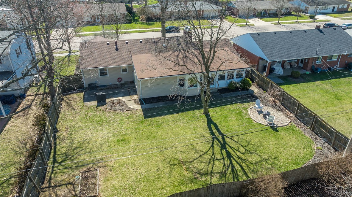1463 Chelsea Road Troy, OH 45373 - Photo 39 of 39 This inviting outdoor space features a well-maintained lawn and a cozy fire pit area.