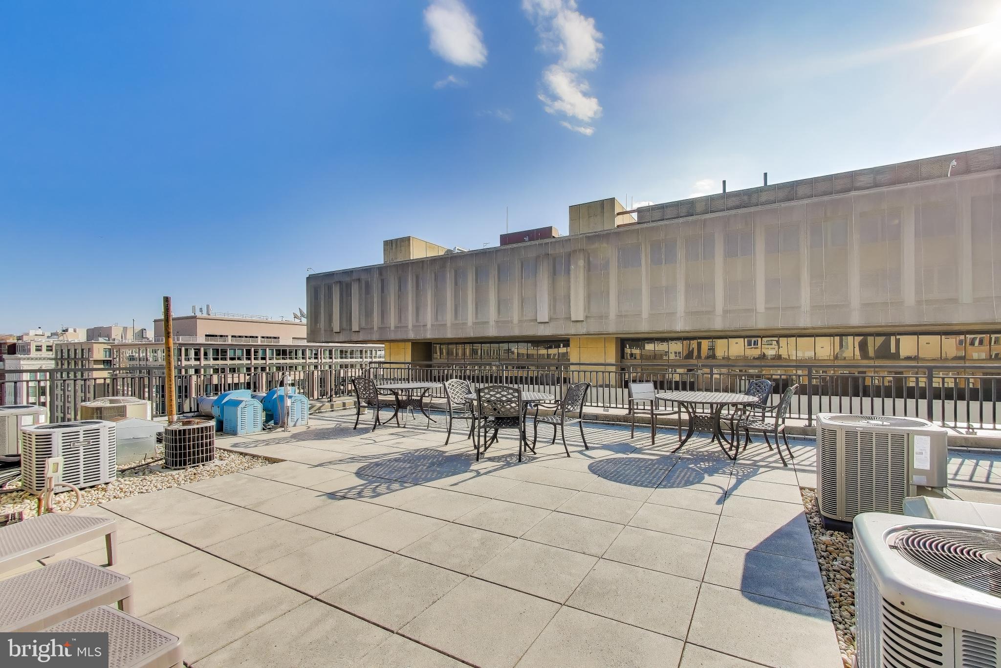 915 E Street Northwest, Unit 414 Washington, DC 20004 - Photo 33 of 35 a view of a patio with a table and chairs