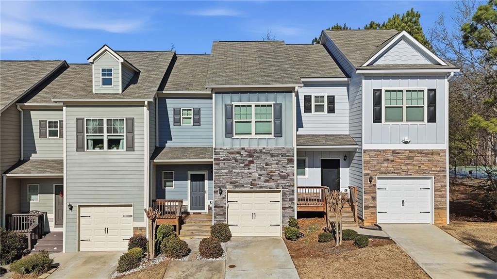 112 Spring Way Square Canton, GA 30114 - Photo 2 of 41 a front view of a house with glass windows