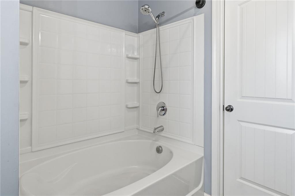 112 Spring Way Square Canton, GA 30114 - Photo 21 of 41 a bathroom with a shower and a bath tub