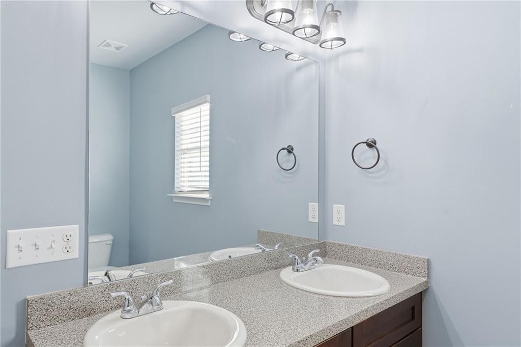 112 Spring Way Square Canton, GA 30114 - Photo 24 of 41 a bathroom with a sink granite and a mirror