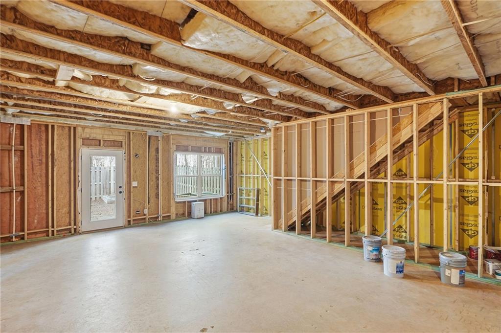 112 Spring Way Square Canton, GA 30114 - Photo 28 of 41 a view of an empty room with wooden floor and windows