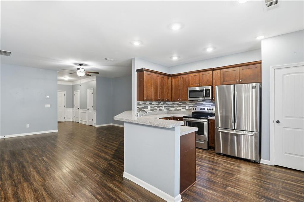 112 Spring Way Square Canton, GA 30114 - Photo 6 of 41 a kitchen with stainless steel appliances granite countertop a refrigerator stove and oven