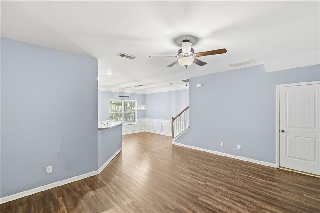 112 Spring Way Square Canton, GA 30114 - Photo 10 of 41 wooden floor in an empty room with a window