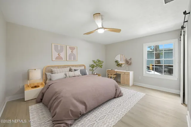 a bedroom with a large bed and a window
