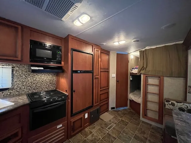 a bathroom with a toilet and a mirror