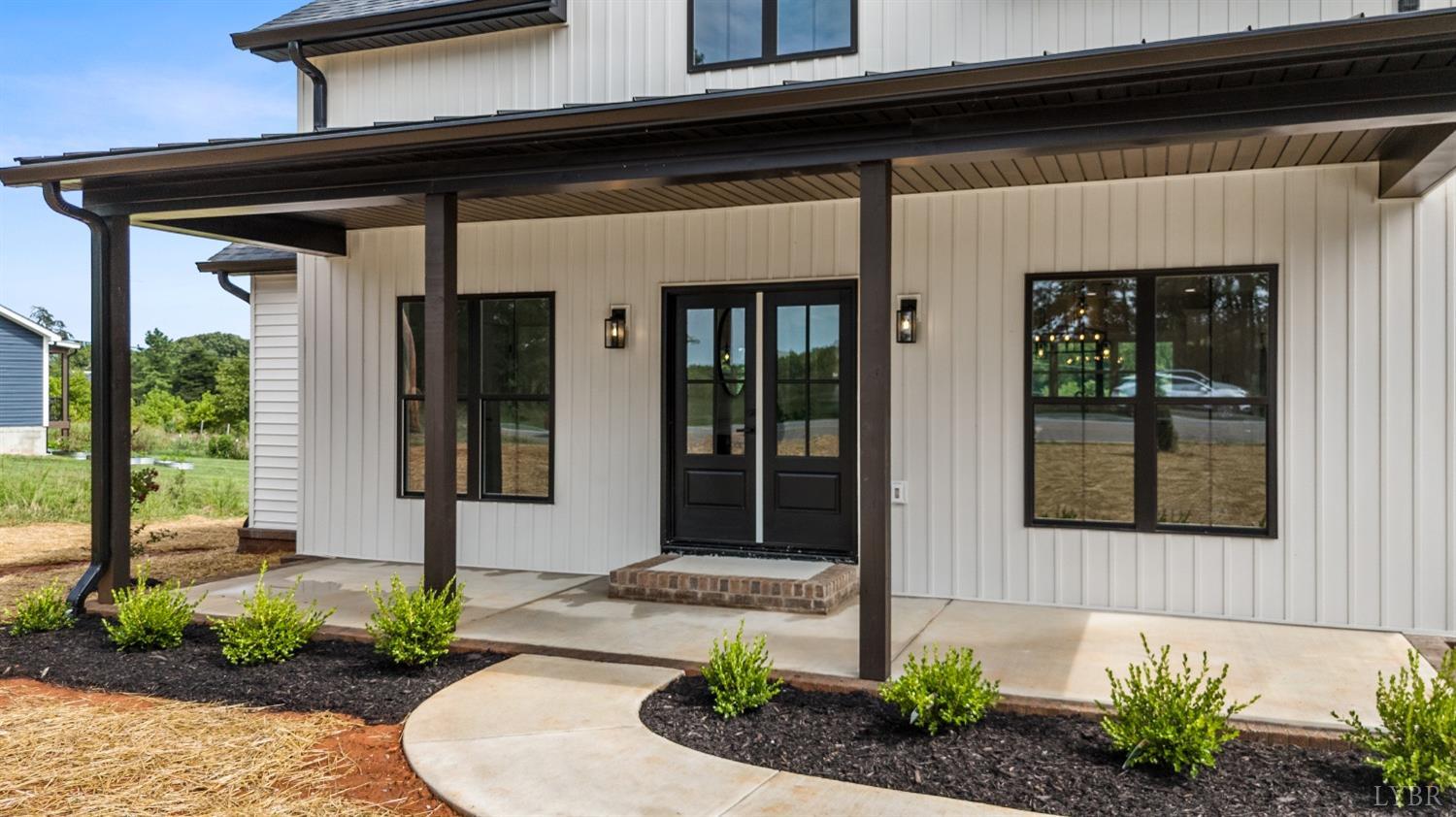 6605 Forest Road Goode, VA 24556 - Photo 14 of 58 a front view of a house with a garden