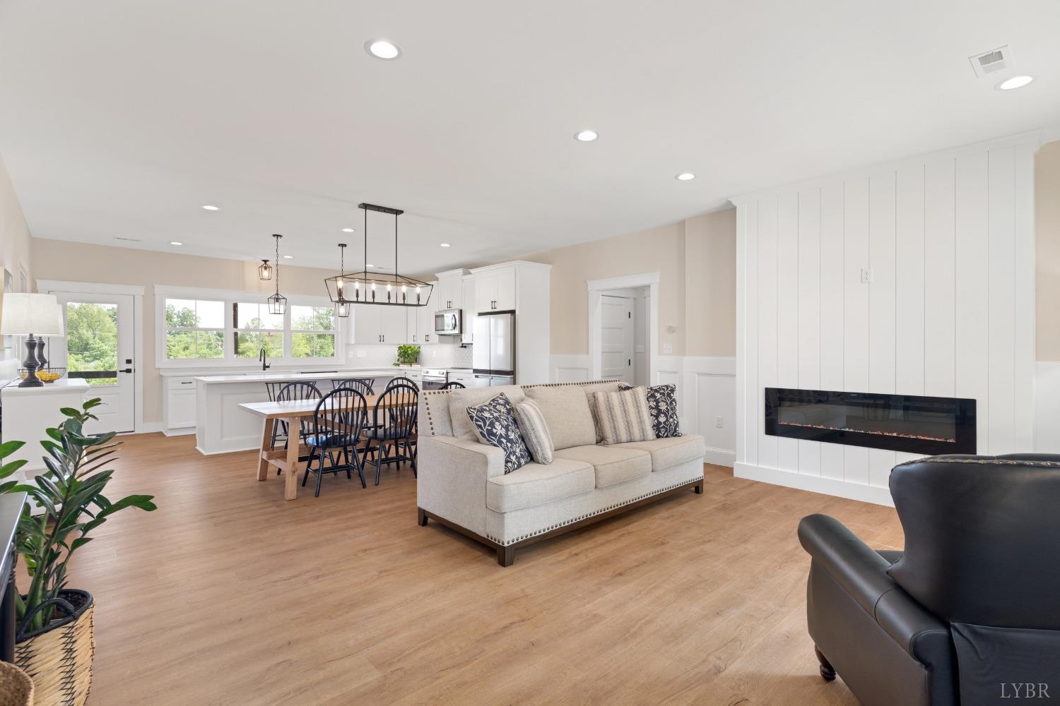 6605 Forest Road Goode, VA 24556 - Photo 17 of 58 a living room with furniture and a table
