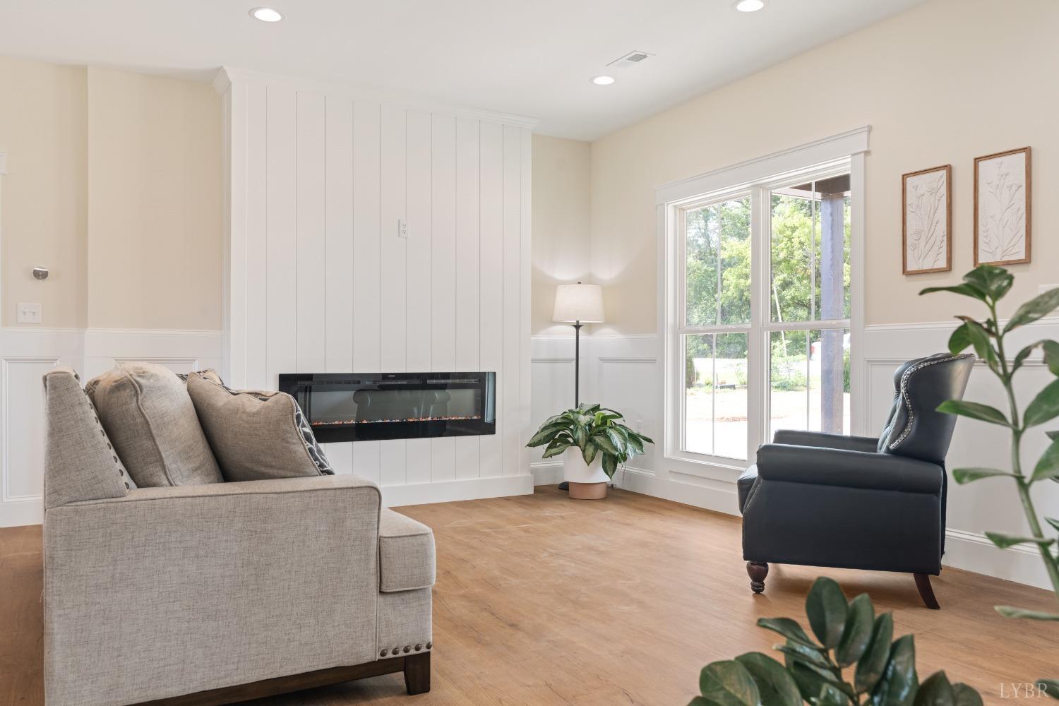 6605 Forest Road Goode, VA 24556 - Photo 18 of 58 a living room with furniture potted plant and a window