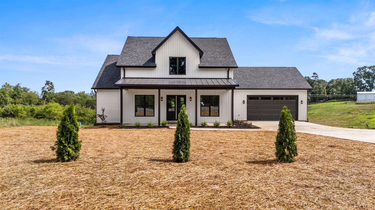 6605 Forest Road Goode, VA 24556 - Photo 2 of 58 a front view of a house with garden