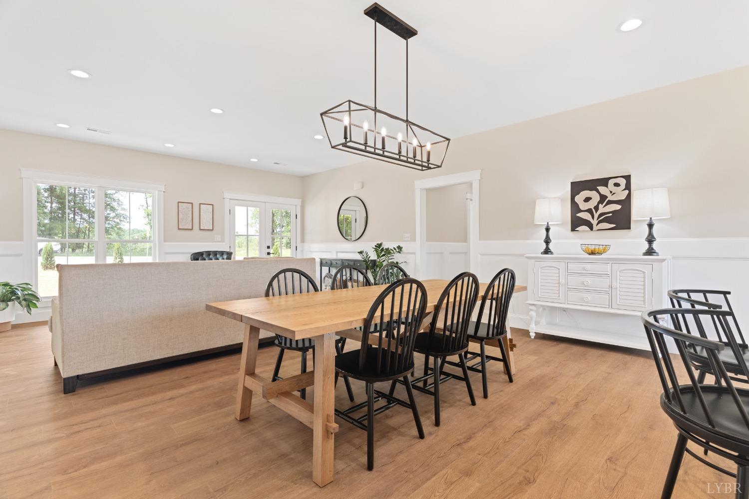 6605 Forest Road Goode, VA 24556 - Photo 22 of 58 a view of a dining room with furniture window and wooden floor