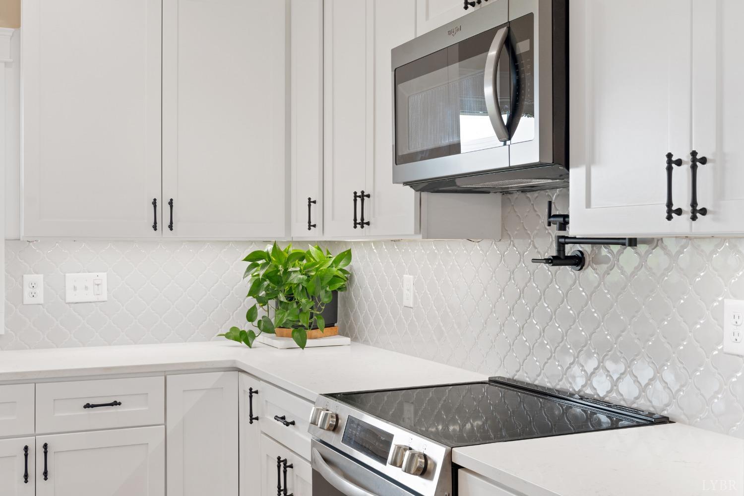 6605 Forest Road Goode, VA 24556 - Photo 26 of 58 a kitchen with a white cabinets and window
