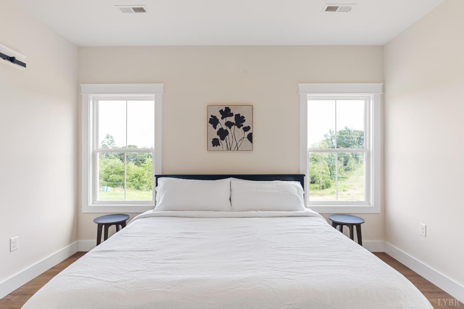 6605 Forest Road Goode, VA 24556 - Photo 38 of 58 a bedroom with a large bed and a window