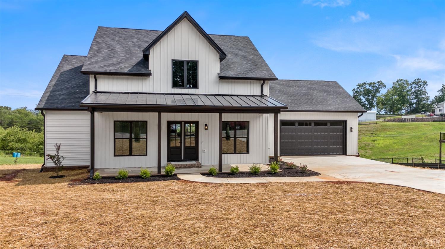 6605 Forest Road Goode, VA 24556 - Photo 4 of 58 a front view of a house with a yard