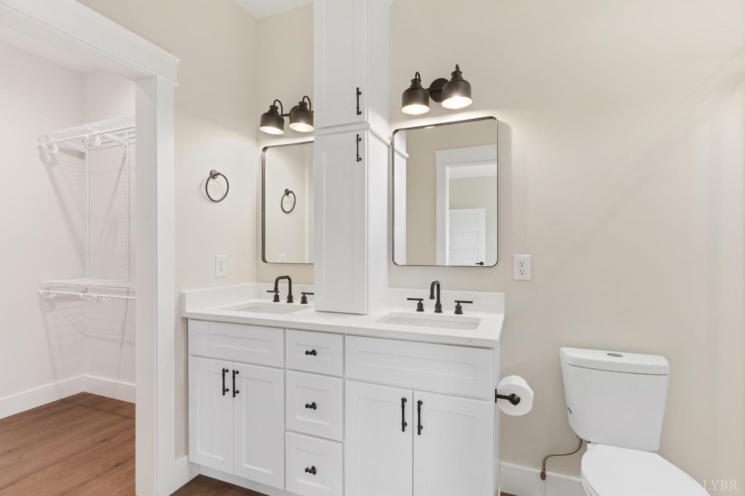6605 Forest Road Goode, VA 24556 - Photo 41 of 58 a bathroom with a toilet sink and mirror