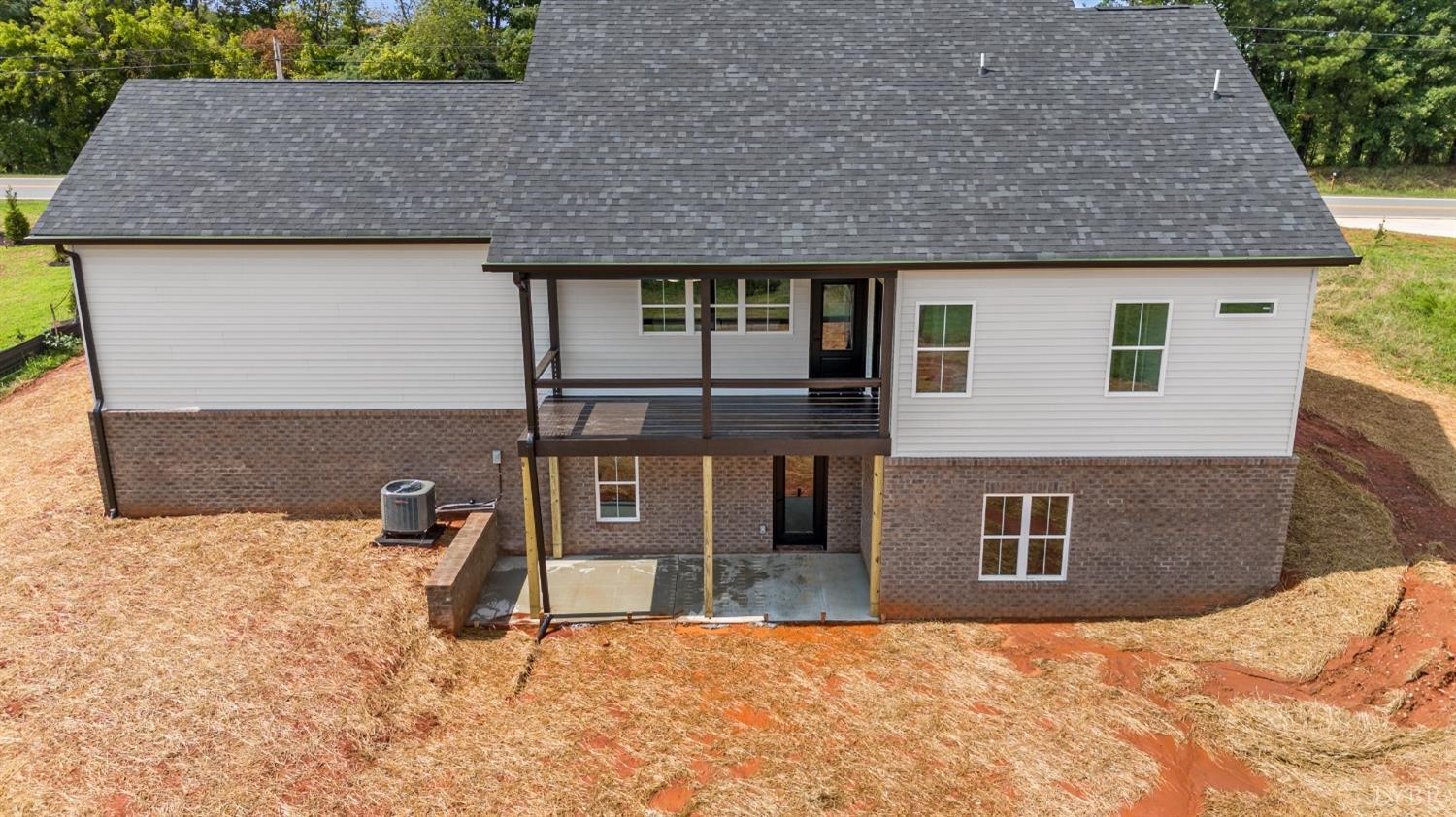 6605 Forest Road Goode, VA 24556 - Photo 7 of 58 a front view of a house with a yard