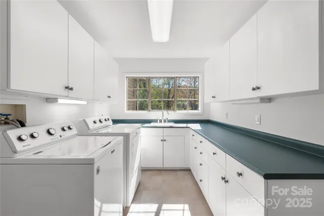 a kitchen that has a sink and a stove in it