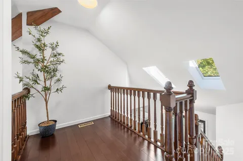 a spacious bedroom with a bed a window and closet