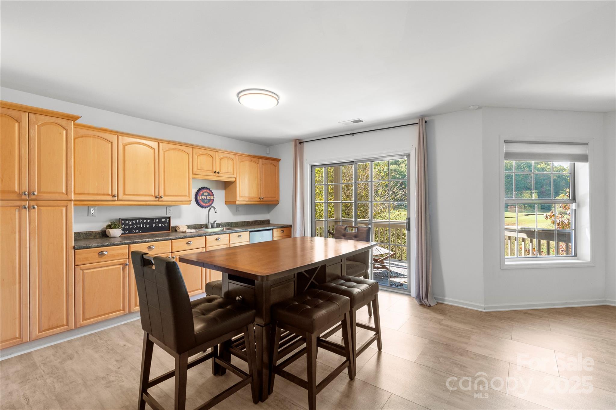 108 June Court Lake Lure, NC 28746 - Photo 27 of 46 a dining room with furniture and window