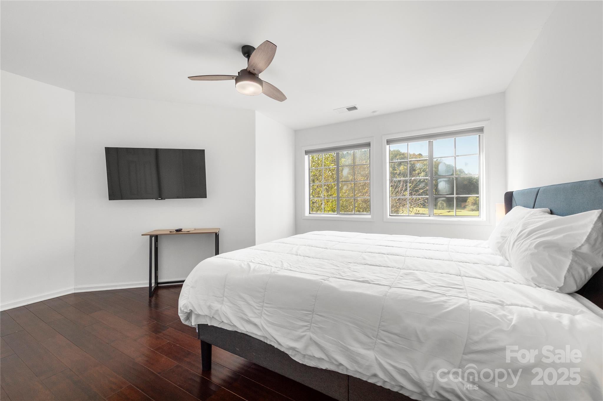 108 June Court Lake Lure, NC 28746 - Photo 28 of 46 a bedroom with a bed tv and a window