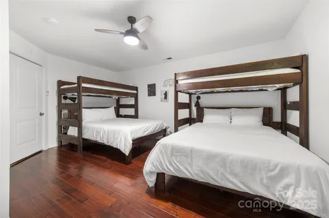 a front view of a house with plants